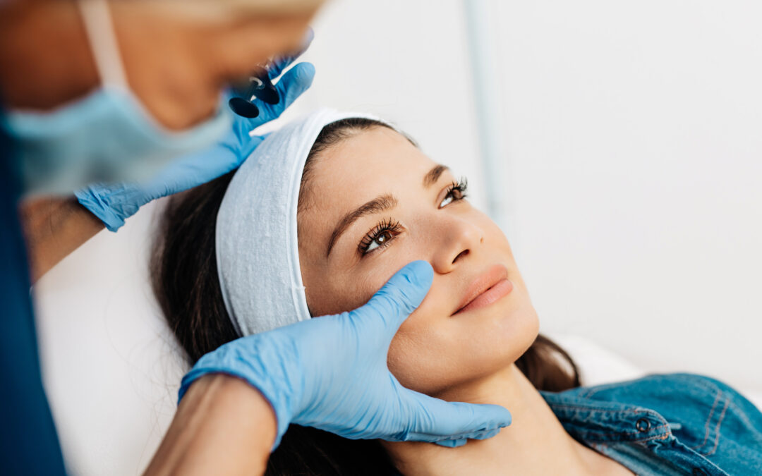 Woman having her face examined by a specialist