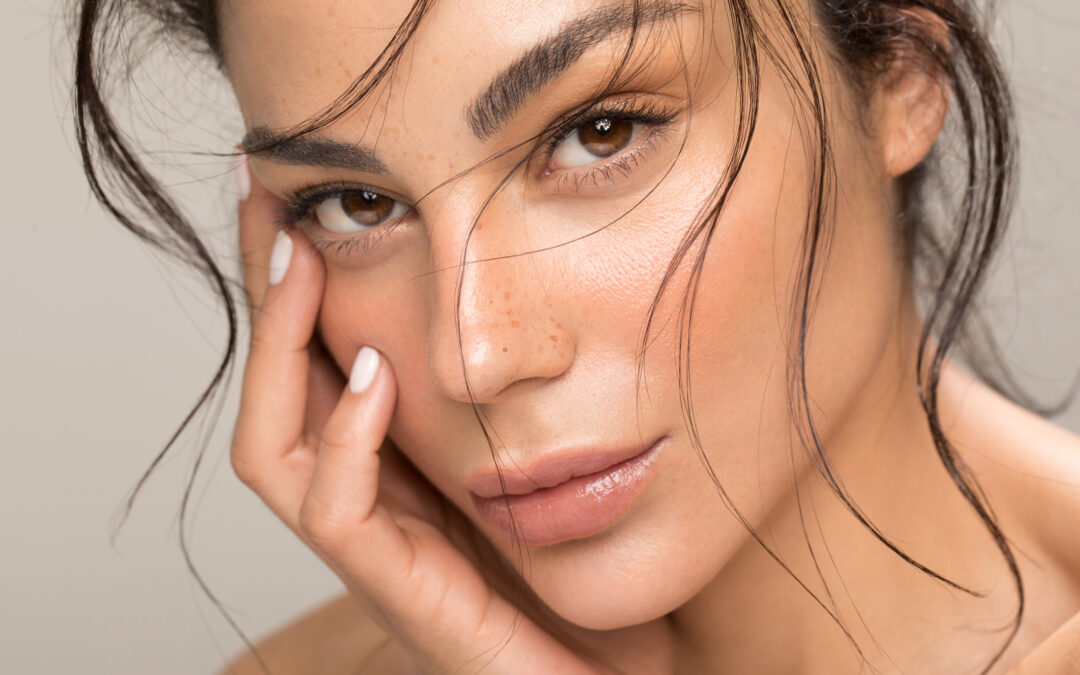 Young woman with glowing skin following HydraFacial treatment