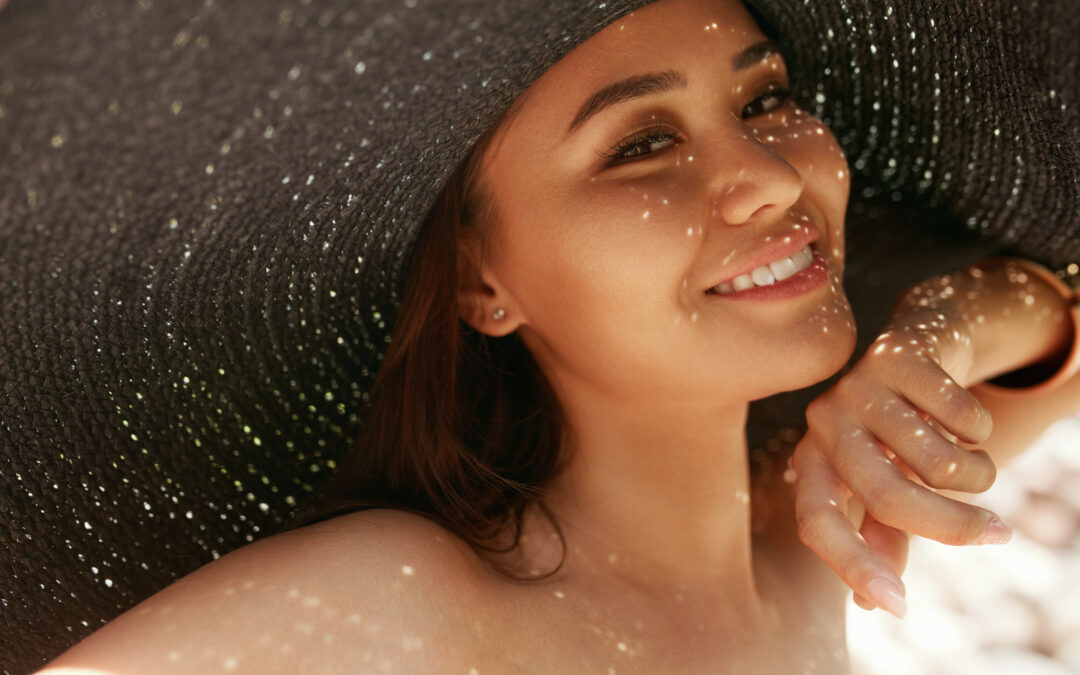 Smiling woman in straw hat during a Wisconsin summer.