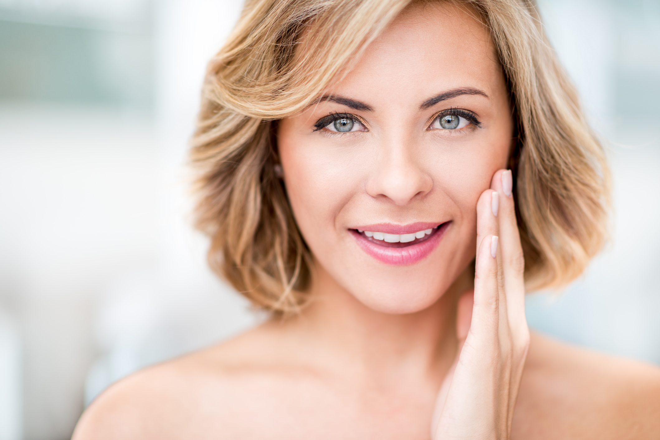 Woman enjoying the benefits of her facial rejuvenation treatment